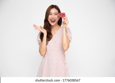 Young Beautiful Asian Woman Smiling Holding Credit Card Isolated On White Background