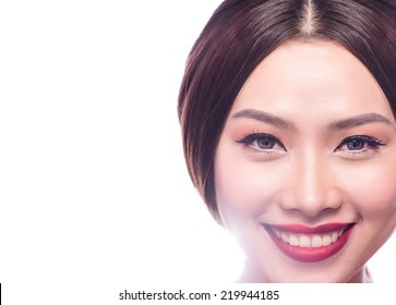 Young and beautiful asian woman with smiling. Woman makeup with blended red lip. Closeup of gorgeous Asian female model getting ready for a night out. Copy-spaced