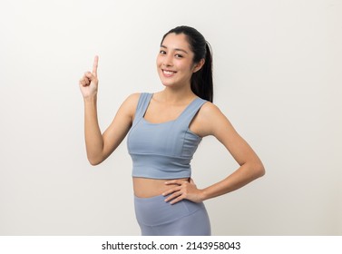 Young Beautiful Asian Woman With Sportswear On Isolated White Background. Portrait Sporty Woman Standing Pose Exercise Workout In Studio.