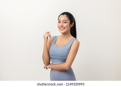 Young Beautiful Asian Woman With Sportswear On Isolated White Background. Portrait Sporty Woman Standing Pose Exercise Workout In Studio.