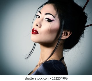 Young beautiful asian woman's portrait, studio shot toned
