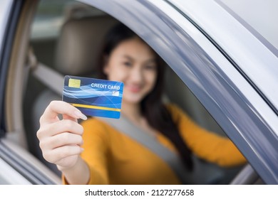 Young Beautiful Asian Women Getting New Car. Hand Holding Credit Card Payment. Car Owner Paying Fuel Pump With Credit Card Customer Mileage Point Loyalty Reward