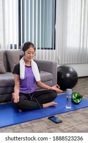 Young Beautiful Asian Women Wearing Fashion Sports Wear Doing Exercise On Mat Indoor Training At Home, Sport And Recreation Concept.