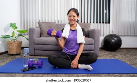 Young Beautiful Asian Women Wearing Fashion Sports Wear Doing Exercise On Mat Indoor Training At Home, Sport And Recreation Concept.