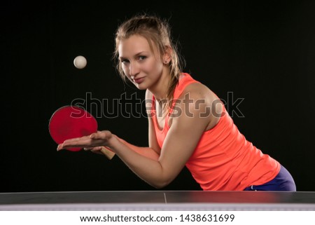 young beautiful athletic girl playing ping pong