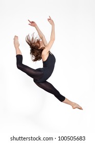 young beautiful ballerina on a gray background
