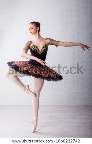 Young beautiful ballet dancer practice to make pirouette