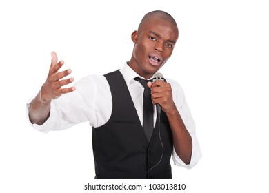 Young And Beautiful Black Man Holding A Microphone And Singing