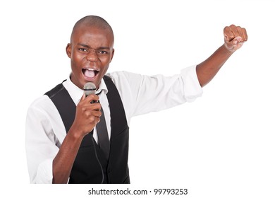 Young And Beautiful Black Man Holding A Microphone And Singing