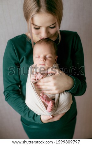 Similar – Image, Stock Photo Mother giving bottle to her newborn