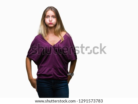 Young beautiful blonde elegant woman over isolated background puffing cheeks with funny face. Mouth inflated with air, crazy expression.