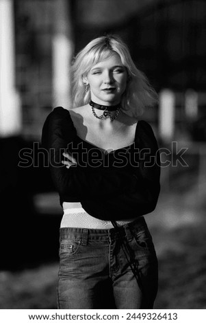 Young beautiful blonde girl in black and white photographs.