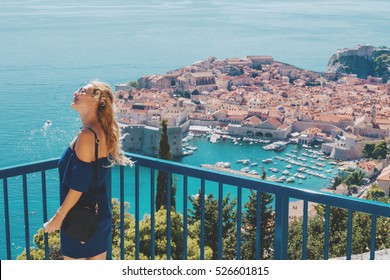 Young Beautiful Blonde Tourist Woman And Dubrovnik Old Town Aerial View