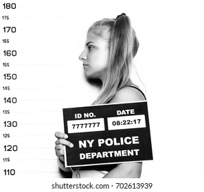 Young Beautiful Blonde Woman Criminal Mug Shots. Black And White