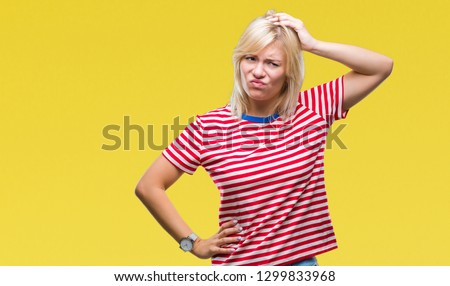 Young beautiful blonde woman over isolated background confuse and wonder about question. Uncertain with doubt, thinking with hand on head. Pensive concept.
