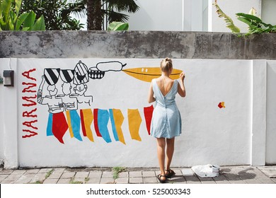 Young Beautiful Blonde Woman Painting The Wall, Street Art In Process, Street Artist - Painter