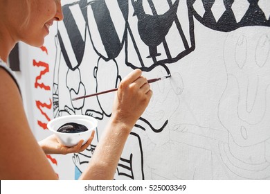 Young Beautiful Blonde Woman Painting The Wall, Street Art In Process, Street Artist - Painter