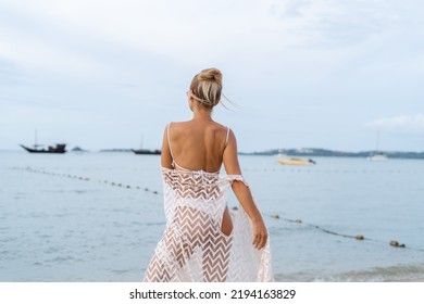 Young Beautiful Blonde Woman In White Cute Bikini, Orange Stylish Glasses And Lace Cape Posing On Beach,soft Natural Life, Romantic, Tender, Woman In Good Shape, Slim, Sporty