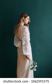 Young Beautiful Bride In Boudoir And Wedding Dress, With A Wreath And A Bouquet In Her Hands. London Wedding Trends, Stylish Photoshoot