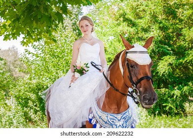 Young beautiful bride riding on horse
