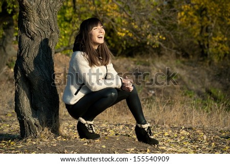 Similar – Beautiful young woman smiling and walking happy on the park outdoors