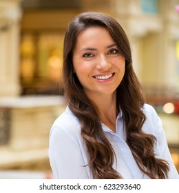 Young beautiful brunette woman in the mall - Shutterstock ID 623293640