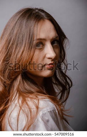 young beautiful brunette woman portrait in studio