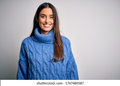 Young beautiful brunette woman wearing casual turtleneck sweater over white background with a happy and cool smile on face. Lucky person. - Shutterstock ID 1767489587
