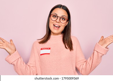 Young Beautiful Brunette Woman Wearing Sticker With Hello My Name Is Message Celebrating Victory With Happy Smile And Winner Expression With Raised Hands