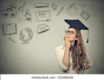 Young beautiful business woman with graduation hat looking up thinking about education isolated on gray wall background  - Powered by Shutterstock