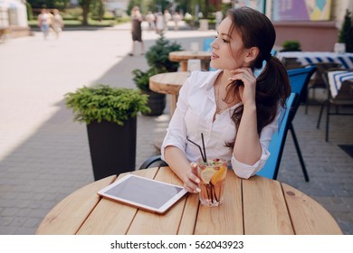 Young Beautiful Business Woman Spends Time Alone With Her Gadgets And Solve Business Issues