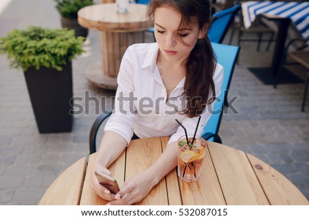 young beautiful business woman spends time alone with her gadgets and solve business issues