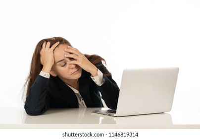 Young beautiful business woman suffering stress working at office computer desk feeling tired and desperate looking overworked overwhelmed and frustrated. In business education, fail and technology