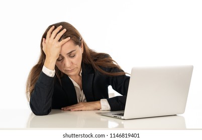 Young beautiful business woman suffering stress working at office computer desk feeling tired and desperate looking overworked overwhelmed and frustrated. In business education, fail and technology