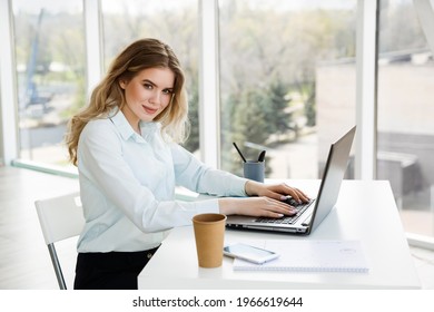 Young beautiful businesswoman works in the office with a laptop. Success concept  - Shutterstock ID 1966619644