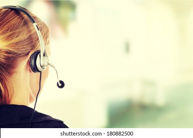 Young beautiful call center worker  - Powered by Shutterstock