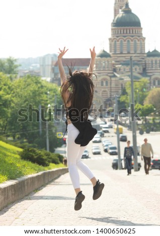 Similar – beautiful young woman having fun outside in park