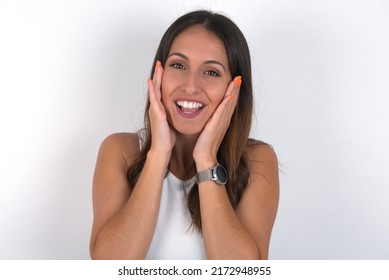 Young Beautiful Caucasian Woman Wearing White Top Over White Background Pleasant Looking Cheerful, Happy Reaction