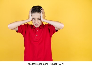 Young Beautiful Child Boy Over Isolated Yellow Background Suffering From Headache Desperate And Stressed Because Pain And Migraine With Her Hands On Head