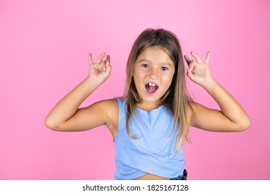 Young beautiful child girl over isolated pink background doing ok sign with fingers and smiling, excellent symbol - Shutterstock ID 1825167128