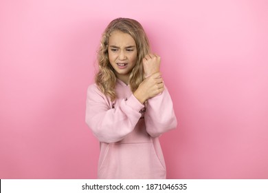 Young Beautiful Child Girl Standing Over Isolated Pink Background Suffering Pain On Hands And Fingers, Arthritis Inflammation