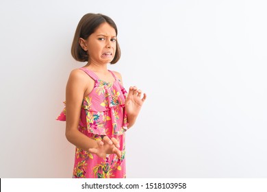 Young Beautiful Child Girl Wearing Pink Floral Dress Standing Over Isolated White Background Disgusted Expression, Displeased And Fearful Doing Disgust Face Because Aversion Reaction. 