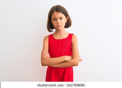 Young Beautiful Child Girl Wearing Red Casual Dress Standing Over Isolated White Background Skeptic And Nervous, Disapproving Expression On Face With Crossed Arms. Negative Person.