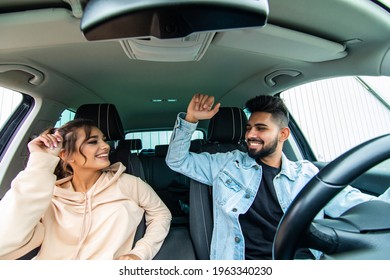 Young Beautiful Couple Dancing In The Car Under Dance Music