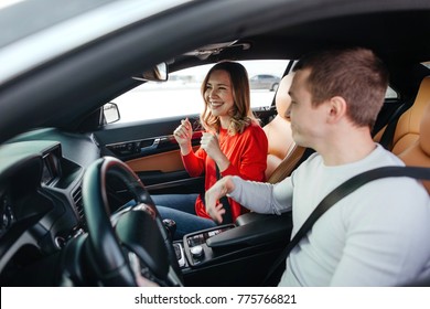 Young Beautiful Couple Dancing In The Car Under Dance Music, The View From The Street Through Car Window