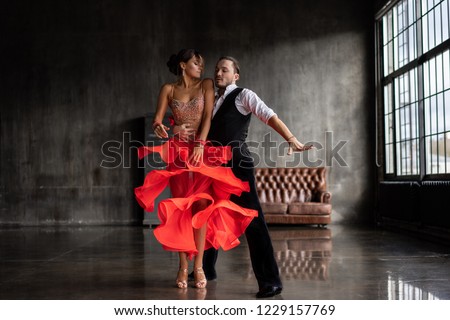 young beautiful couple dancing tango