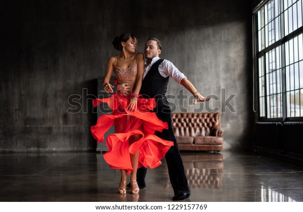 young beautiful couple\
dancing tango
