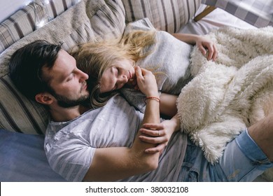 
young beautiful couple embracing in bed  - Powered by Shutterstock
