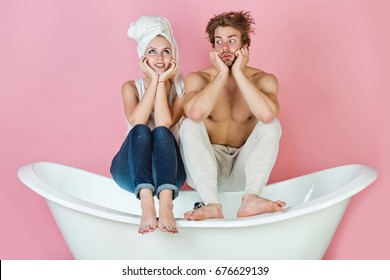 young beautiful couple in love sitting on bath, surprised man and happy woman