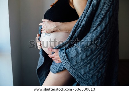 Similar – Pregnant woman embraced by her husband